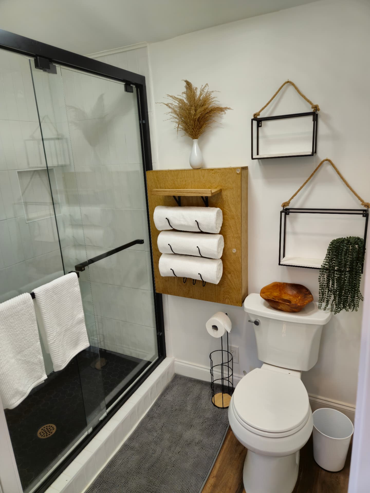 Urban Oasis — bathroom with shower and rolled towels
