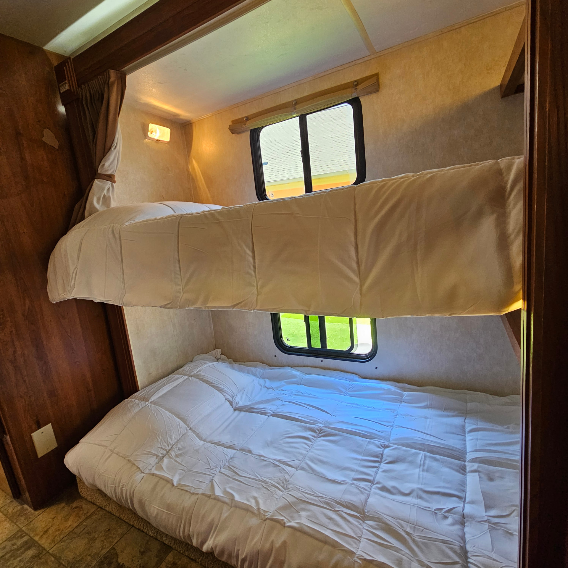 Coachman RV — bunk beds with upper and lower sleeping areas
